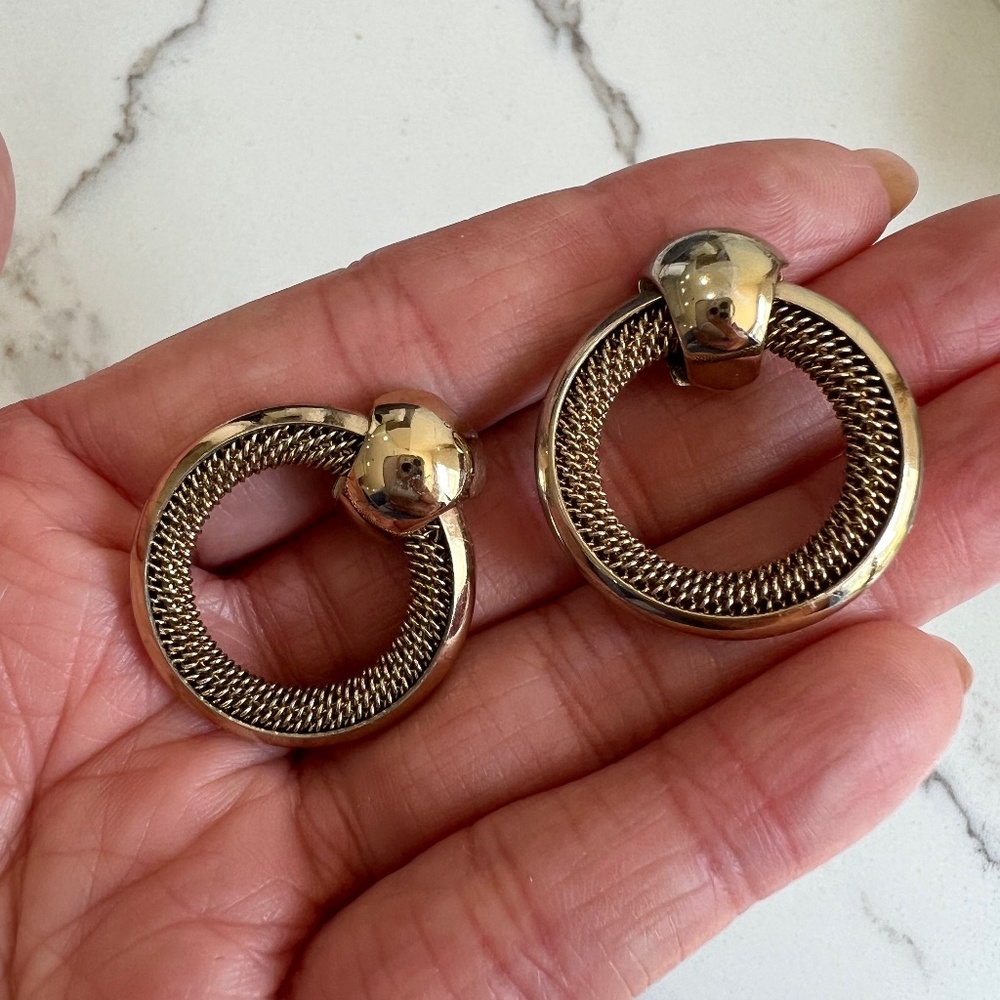 Round knocker shaped gold tone earrings